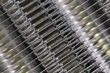 Details of the car engine radiator. Macro close-up of the radiator plates.