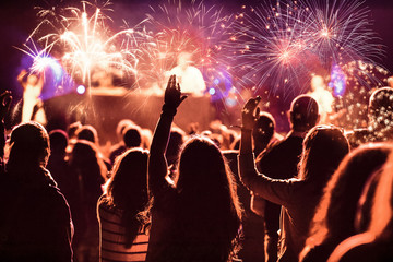 Fototapeta na wymiar crowd watching fireworks at New Year