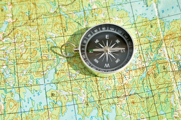 Fototapeta na wymiar Symbols of travel - map with compass.