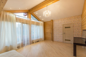 Wooden bedroom interior with high beamed ceiling