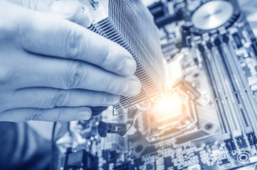 Hand installing the computer chip 