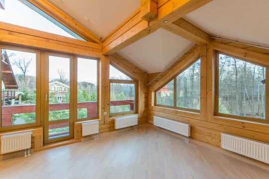Large empty room in a wooden cottage
