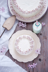 White cake with pink flowers