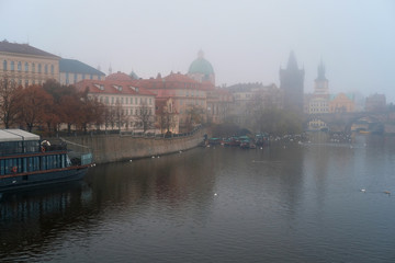 Prague, Czechia - November, 21, 2016: morning fog on Vltava river in Prague, Czechia.