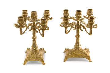 Two vintage gold candle holder on a white background