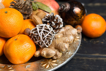 Winter Christmas fruits and nuts on silver plate