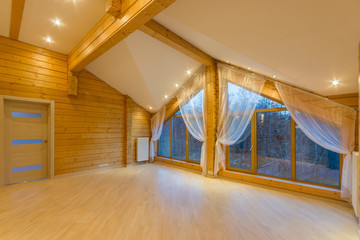 Large empty room in a new log cabin