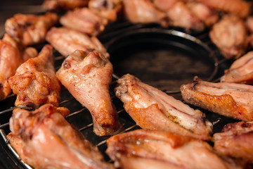 Fried chicken wings on a grill
