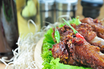 Fried chicken with seasoning set up on table, food stylist