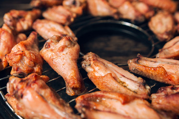 Fried chicken wings on a grill
