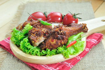 Fried chicken with seasoning set up on table, food stylist