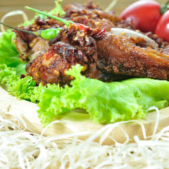 Fried chicken with seasoning set up on table, food stylist