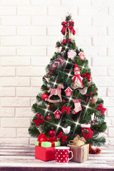 Christmas decorations. Christmas background. Beautiful holidiay decorated room with Christmas tree with presents under it