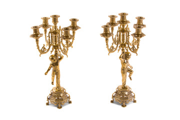 Two vintage gold candle holder on a white background