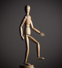 The wooden figure of a man