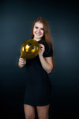 the girl with a yellow ball with a smile