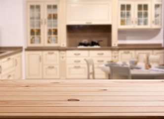 top of wooden table and kitchen space