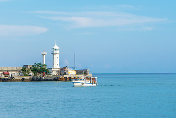 Fototapeta na wymiar The lighthouse at the seaport of Yalta