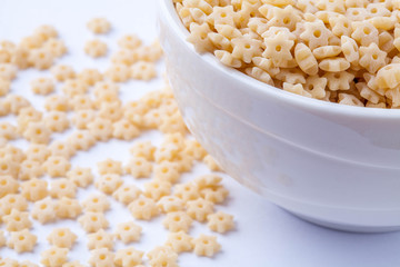 raw pasta in a white bowl