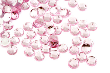 Pink rhinestone on white background