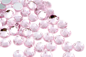 Pink rhinestone on white background