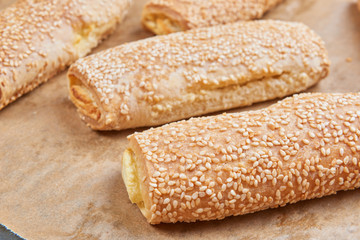 Homemade appetizers with cheese fillings. Cakes sprinkled with s