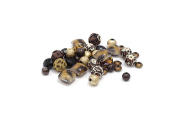 Decorative colorful beads scattered on white background - accessories for handmade and hobby