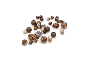 Decorative colorful beads scattered on white background - accessories for handmade and hobby