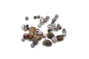 Decorative colorful beads scattered on white background - accessories for handmade and hobby