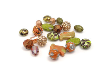 Decorative colorful beads scattered on white background - accessories for handmade and hobby