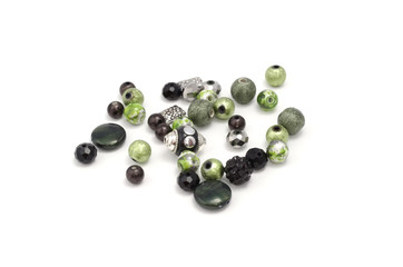 Decorative colorful beads scattered on white background - accessories for handmade and hobby
