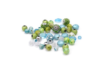 Decorative colorful beads scattered on white background - accessories for handmade and hobby