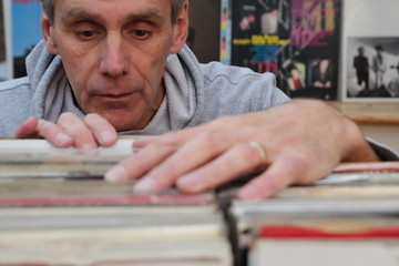 Record collector looking through vinyl 7