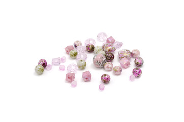 Decorative colorful beads scattered on white background - accessories for handmade and hobby