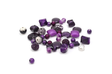 Decorative colorful beads scattered on white background - accessories for handmade and hobby