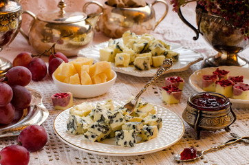 Roquefort cheese on a plate. A beautiful table setting.