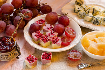 Cheeses, fruits and desserts. Beautiful set-up.