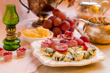 Cheeses, fruits and desserts. Beautiful set-up.