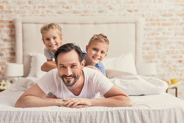 Fototapeta premium Children with daddy at home