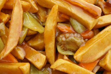 Chinese food. Fried potato chips in sauce