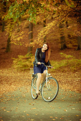 Fototapeta premium Girl in dress on bike.