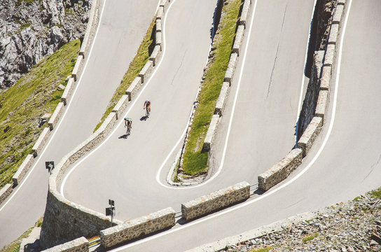 Riders on famous Stelvio pass, Dolomites, Italy.