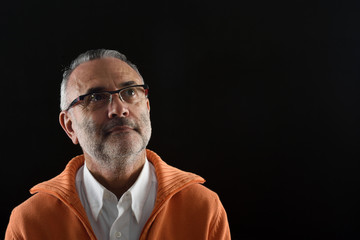 Portrait of a man with black background