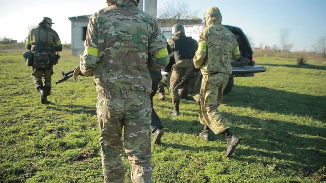 militias are fighting. Men in camouflage with guns and playing airsoft. war