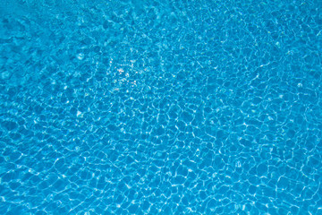 Fototapeta na wymiar Beautiful rippled water surface in swimming pool