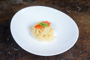 italian spaghetti with tomato and basil in a pot