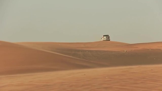 Desert Safari SUVs bashing through the arabian sand dunes 2