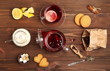 Tea set on wooden background, flat lay