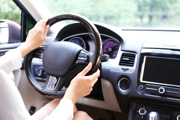 Young woman driving car