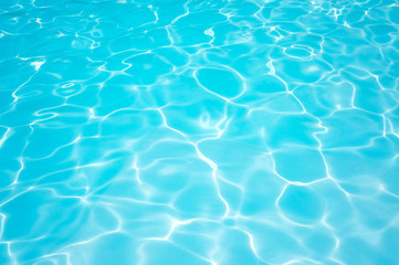 Naklejka na ściany i meble Beautiful ripple Water in swimming pool with sun reflection